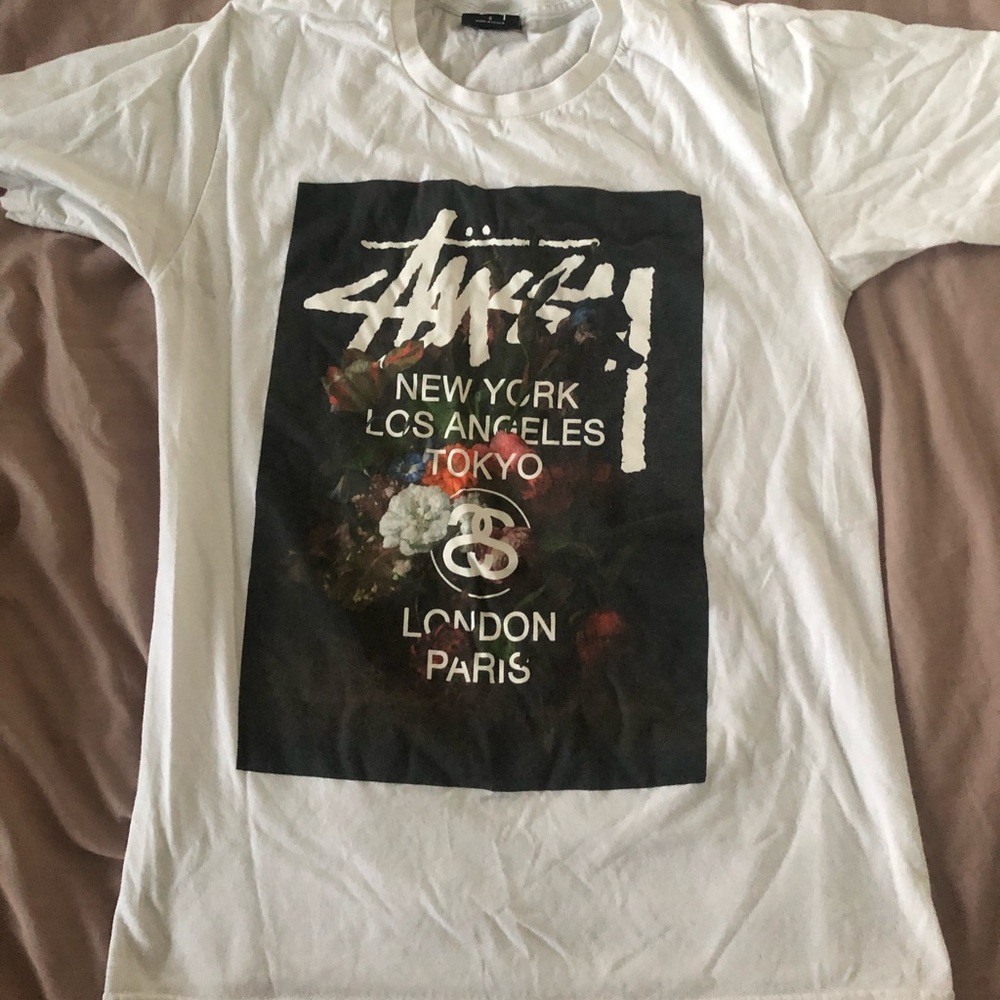 Stussy white tee with floral print.